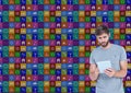 Man using digital tablet with various icons in background Royalty Free Stock Photo
