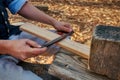 A man using a draw knife.