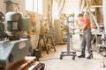 Man using drilling steel machine in carpentry