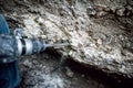 Man using a drilling tool or jackhammer to demolish Royalty Free Stock Photo