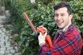 Man using electric hedge trimmer Royalty Free Stock Photo