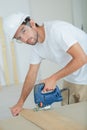 Man using electric jigsaw Royalty Free Stock Photo