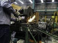 Man is using electricity saw in factory Royalty Free Stock Photo