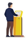 Man using electronic self service payment system.