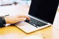 Man using empty laptop screen on table