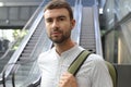 Man using the escalators to move around a modern building Royalty Free Stock Photo