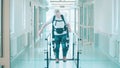 A man is using exosuit to practice walking in the hospital