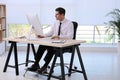 Man using footrest while working on computer Royalty Free Stock Photo