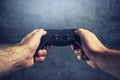 Man using gamepad controller to play video games Royalty Free Stock Photo