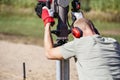 Man using gasoline hand held pole ramming tool outdoors on construction site. Royalty Free Stock Photo