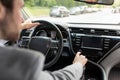 Man using gps navigation system in car for travel on new road in city Royalty Free Stock Photo