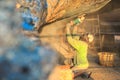 A man using grinder in preparation for anti foul paint being app