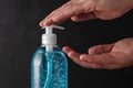 Man is using hand sanitizer alcohol gel to wash hands. Coronavirus prevention concept Royalty Free Stock Photo