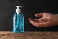 Man is using hand sanitizer alcohol gel to wash hands. Coronavirus prevention concept Royalty Free Stock Photo