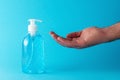 Man is using hand sanitizer alcohol gel to wash hands. Coronavirus prevention concept Royalty Free Stock Photo