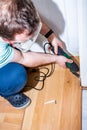 Man using his electric multi tool on laminate