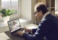 Man using his laptop, enjoying virtual visit to clinic and consulting online doctor