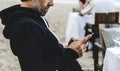 Man using his mobile phone at the beach Royalty Free Stock Photo