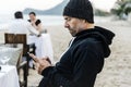 Man using his mobile phone at the beach Royalty Free Stock Photo