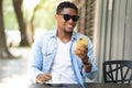 Man using his mobile phone at coffee shop. Royalty Free Stock Photo