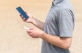 Man using his phone and holding card Royalty Free Stock Photo