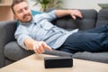 Man using home assistant bluetooth speaker Royalty Free Stock Photo