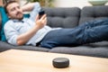 Man using home assistant bluetooth speaker Royalty Free Stock Photo