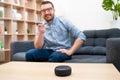 Man using home assistant bluetooth speaker Royalty Free Stock Photo