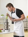 Man Using Juicer Royalty Free Stock Photo