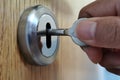 Man using a key to open the door. Royalty Free Stock Photo