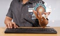A man is using a keyboard to search the internet, online shopping ideas by typing on a keyboard and using a computer. Royalty Free Stock Photo