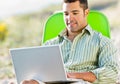 Man using laptop at beach Royalty Free Stock Photo