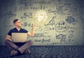 Man using laptop on a background with science formulas Royalty Free Stock Photo