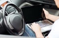 Man using laptop computer in car Royalty Free Stock Photo