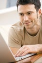 Man using laptop computer at home Royalty Free Stock Photo