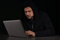 Man using laptop. Criminal activity Royalty Free Stock Photo