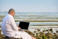 Man using laptop while having his holiday Royalty Free Stock Photo