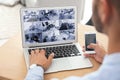 Man using laptop for monitoring CCTV cameras