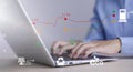 Man using laptop with Oil energy graph of the world market, impact on the economy concept,Businessman touch chart with the indicat