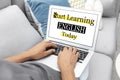 Man using laptop for online English learning