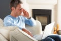 Man Using Laptop Relaxing Sitting On Sofa At Home Royalty Free Stock Photo