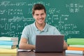 Man Using Laptop While Studying Royalty Free Stock Photo