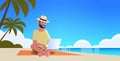 Man using laptop on tropical sea beach summer vacation online communication blogging concept seascape background full Royalty Free Stock Photo