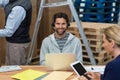 Man using laptop in warehouse Royalty Free Stock Photo