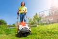 Man using lawnmower grass clipper at the backyard Royalty Free Stock Photo