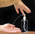 Man using liquid sanitizer