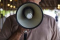 Man Using a Megaphone to Proclaim or Announcement Something with Very Loud Voice