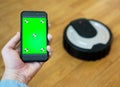 Mobile app to control robotic vacuum cleaner. Royalty Free Stock Photo