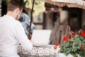 Man using a modern portable computer on an outdoor table Royalty Free Stock Photo