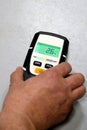 Man using moisture meter for house inspection. Royalty Free Stock Photo